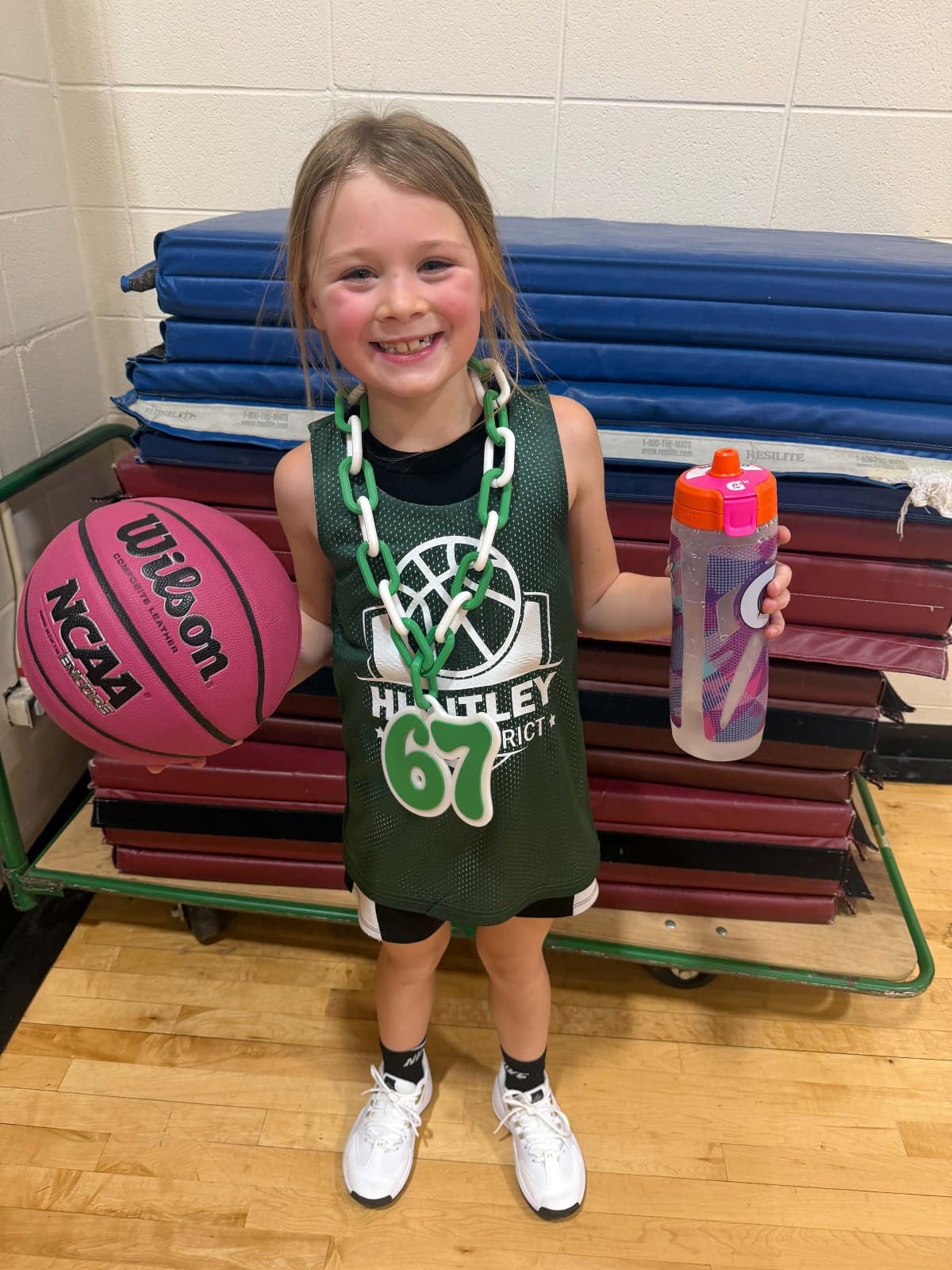 Sloane in her basketball jersey in the gym